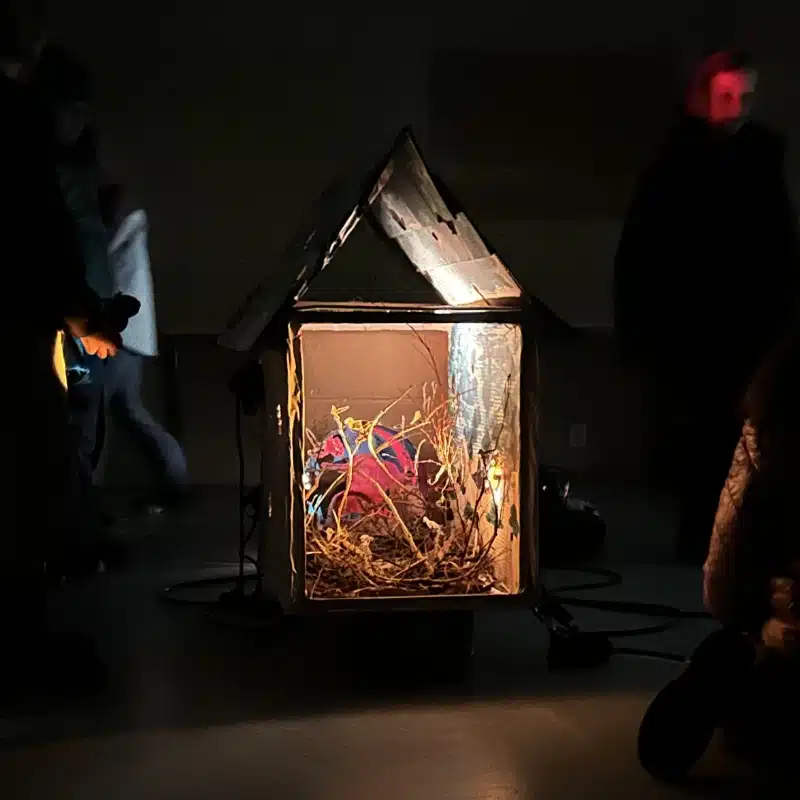 Photo of an installation of a cardboard house